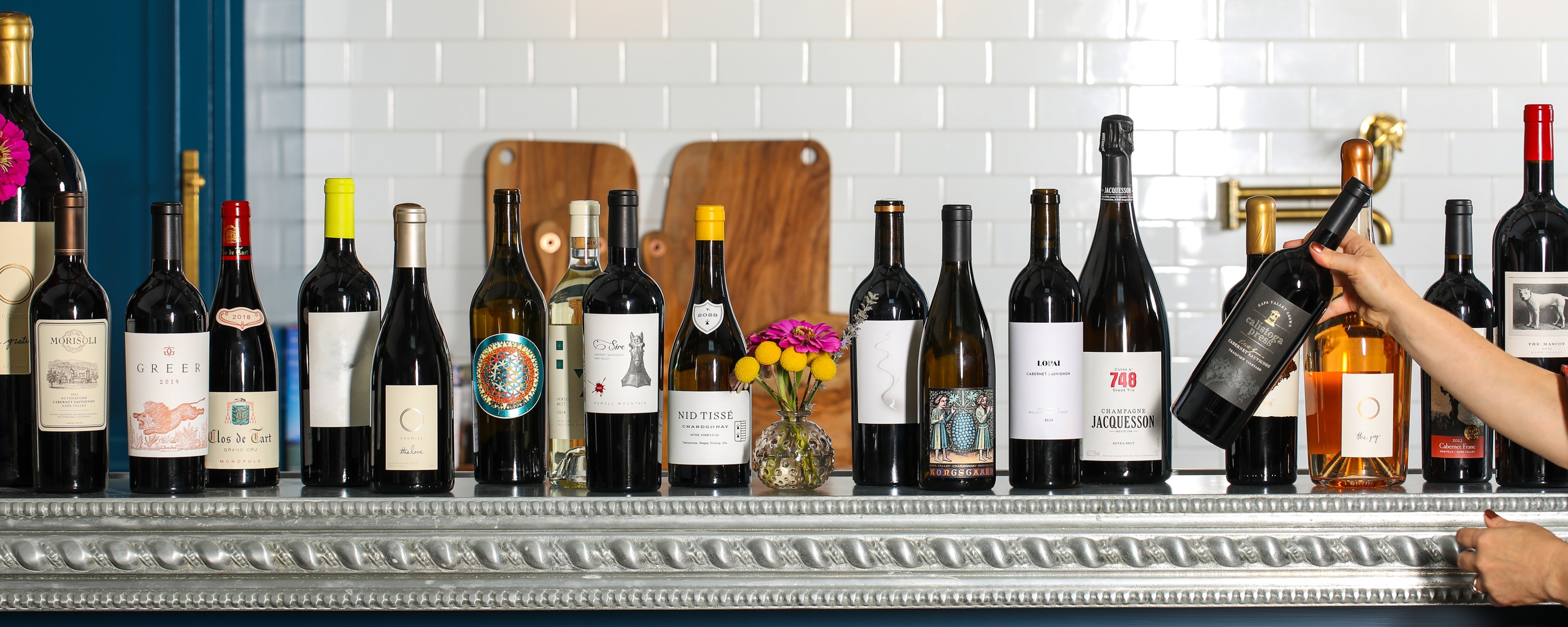 Assorted wine bottles on the wall at ACME Fine Wines.